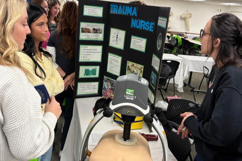 Juniors Ava Jenesky and Kiana Inoue speak with a trauma nurse about her job
