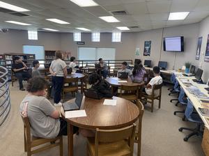 Students researching at their tables