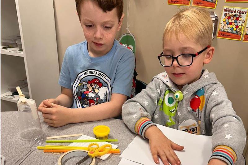 McCullough Elementary kindergarteners William Simmons and Weston Stefanik brainstorm with their supplies