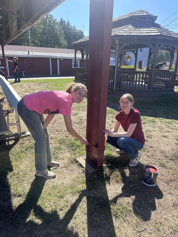 FFA students paint a pole red at the Franklin County Fairgrounds