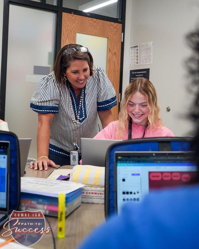 Ms. Wiley working in the AVID classroom with a student.