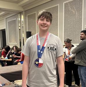 FHS student with their chess medal