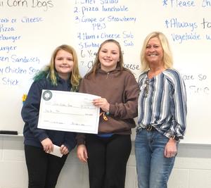 Students present their check to Green Gables.