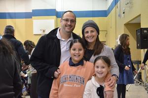 A family poses together after the play.