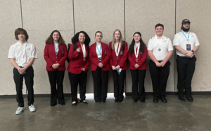 Smiling students with awards