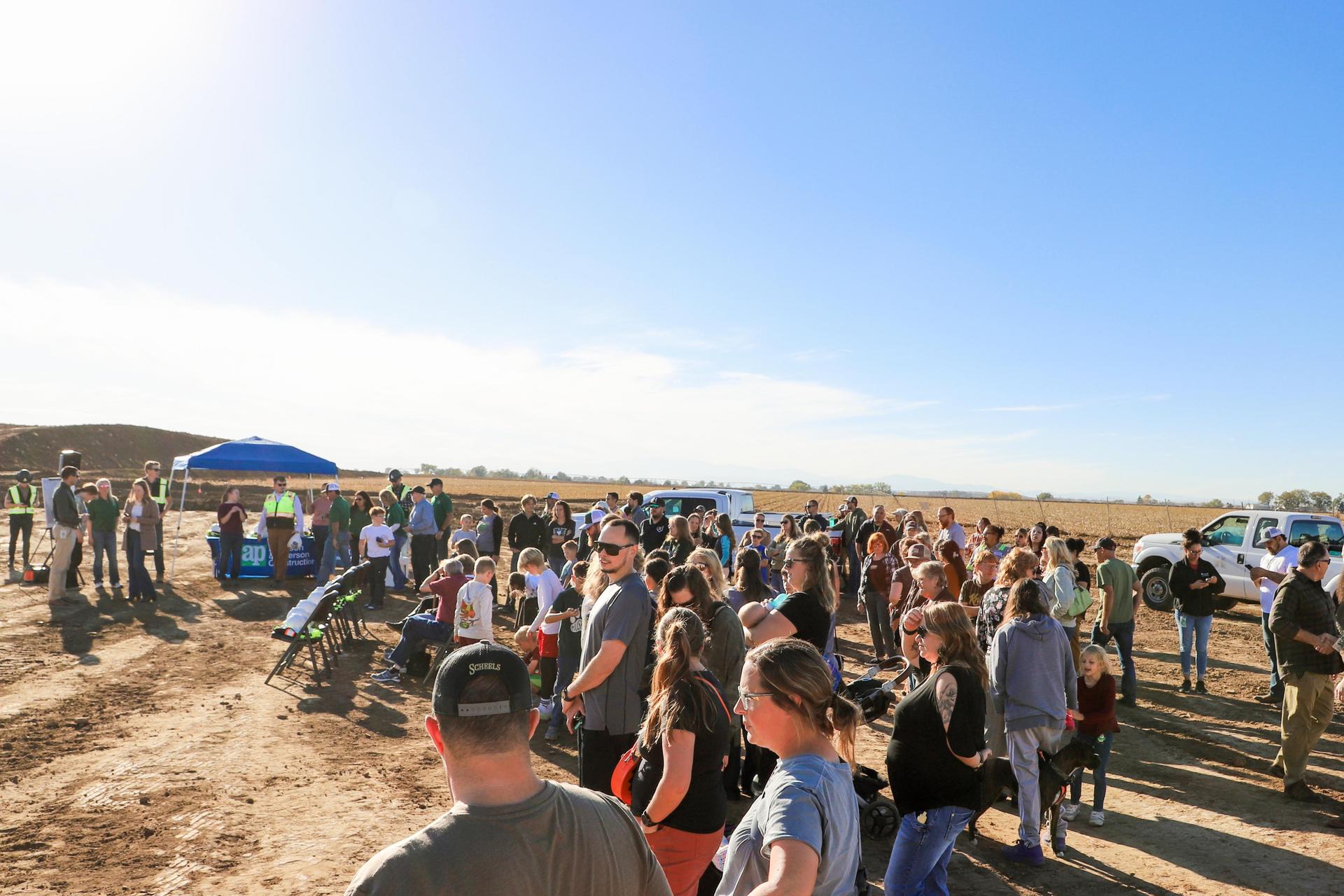 Community members gathered at the ground breaking for the k-8 school