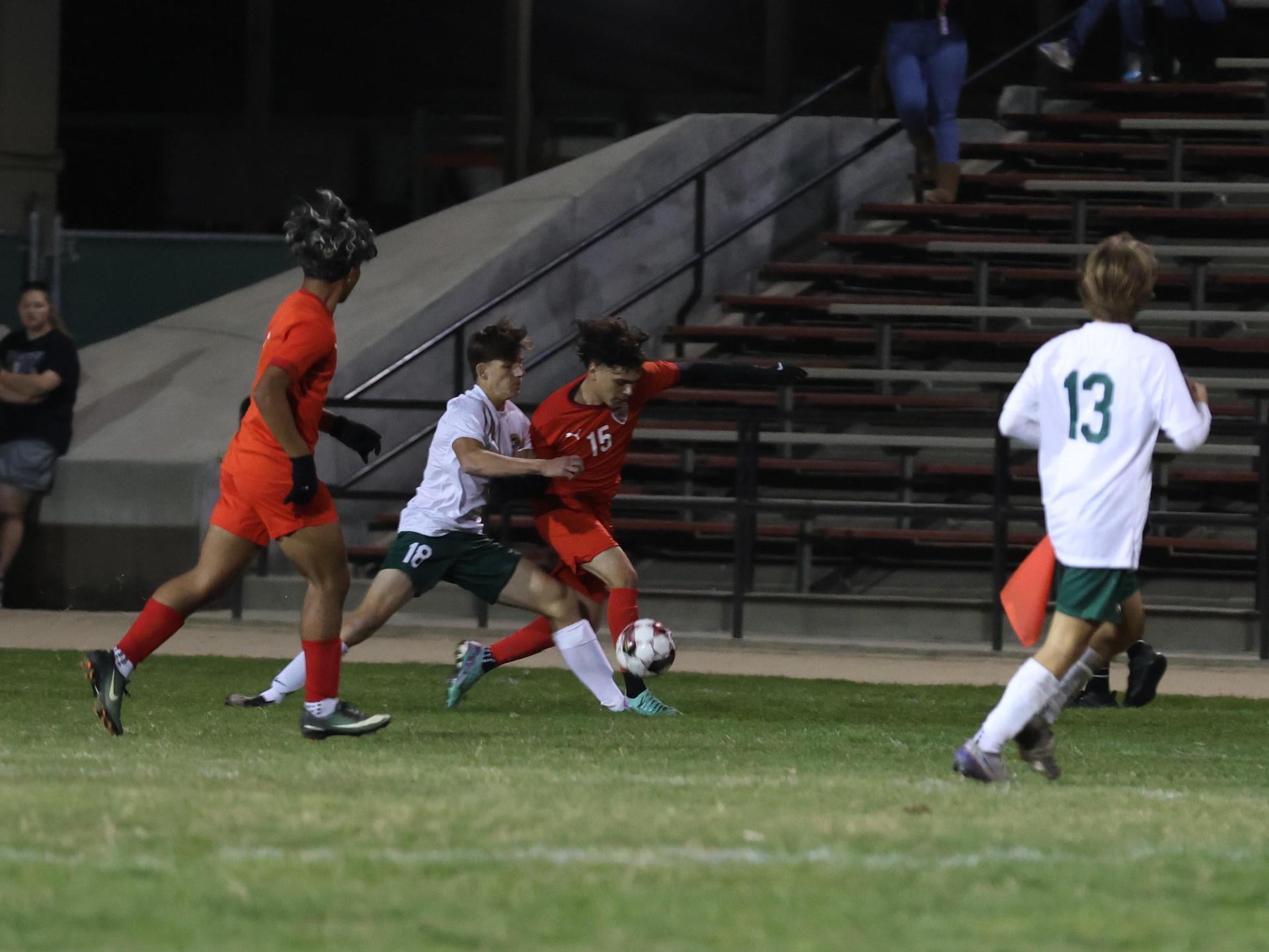 Varsity boys play soccer against Kingsburg