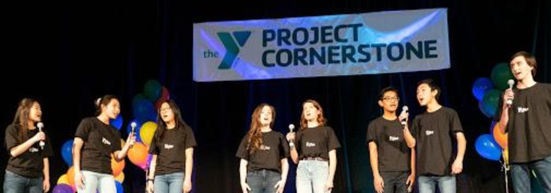 Students singing on a stage