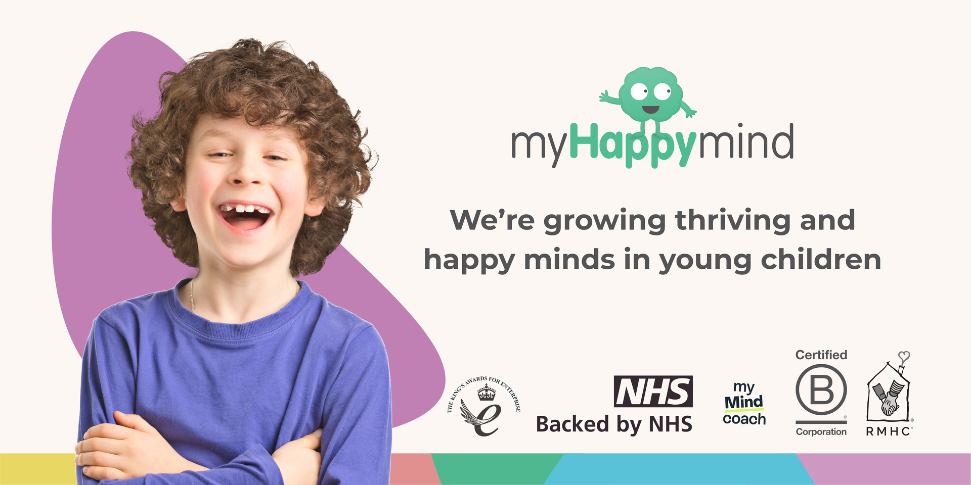 We're growing thriving and happy minds in young children. Image shows a picture of a happy, smiling child with curly hair. 
