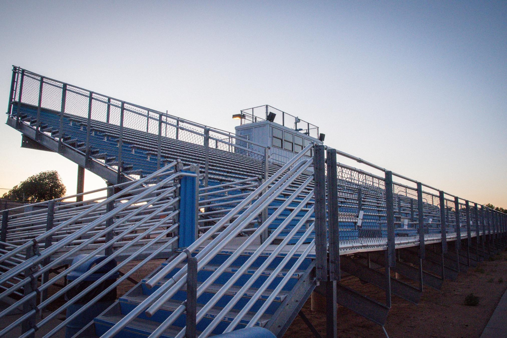 empty bleachers overlooking sports field