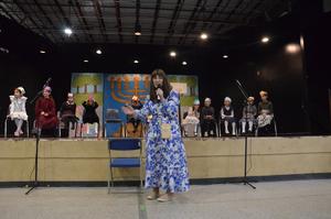 Morah Cohen addresses the students and the parents.