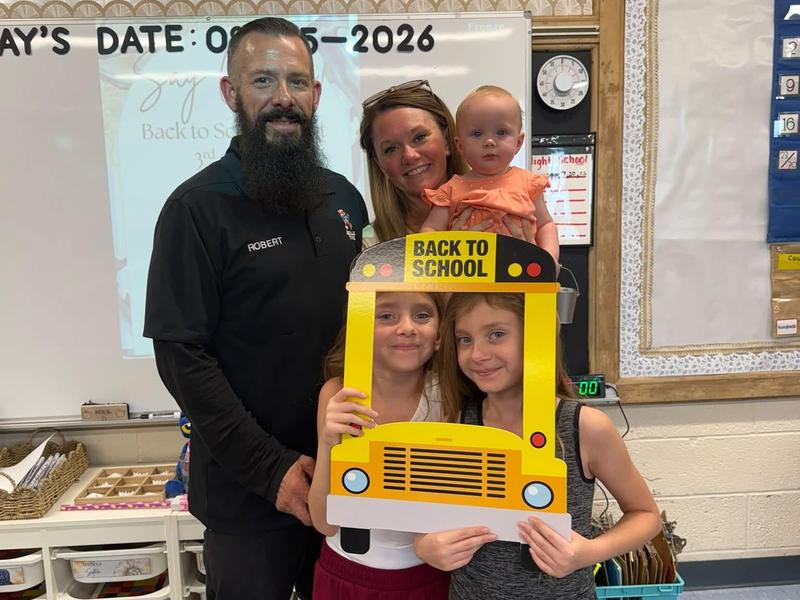 a family poses for a photo at back-to-school night at RES