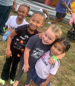 four PHE students smile for the cameras.