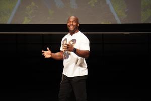 TJ Tyus, a motivational speaker, talks with TK students before their Service Day.