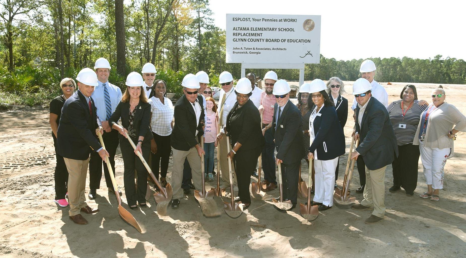 GCSS Board members turn over dirt on new AES.