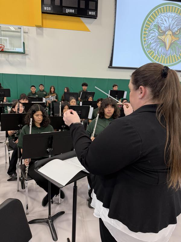 Band leader conducts a concert