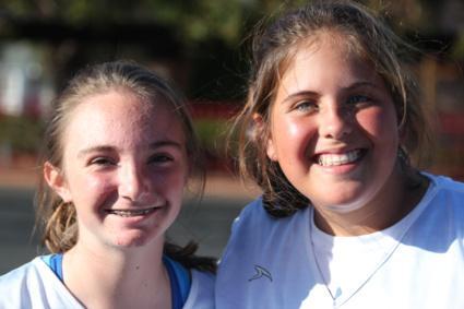 Picture of two girls smiling on campus