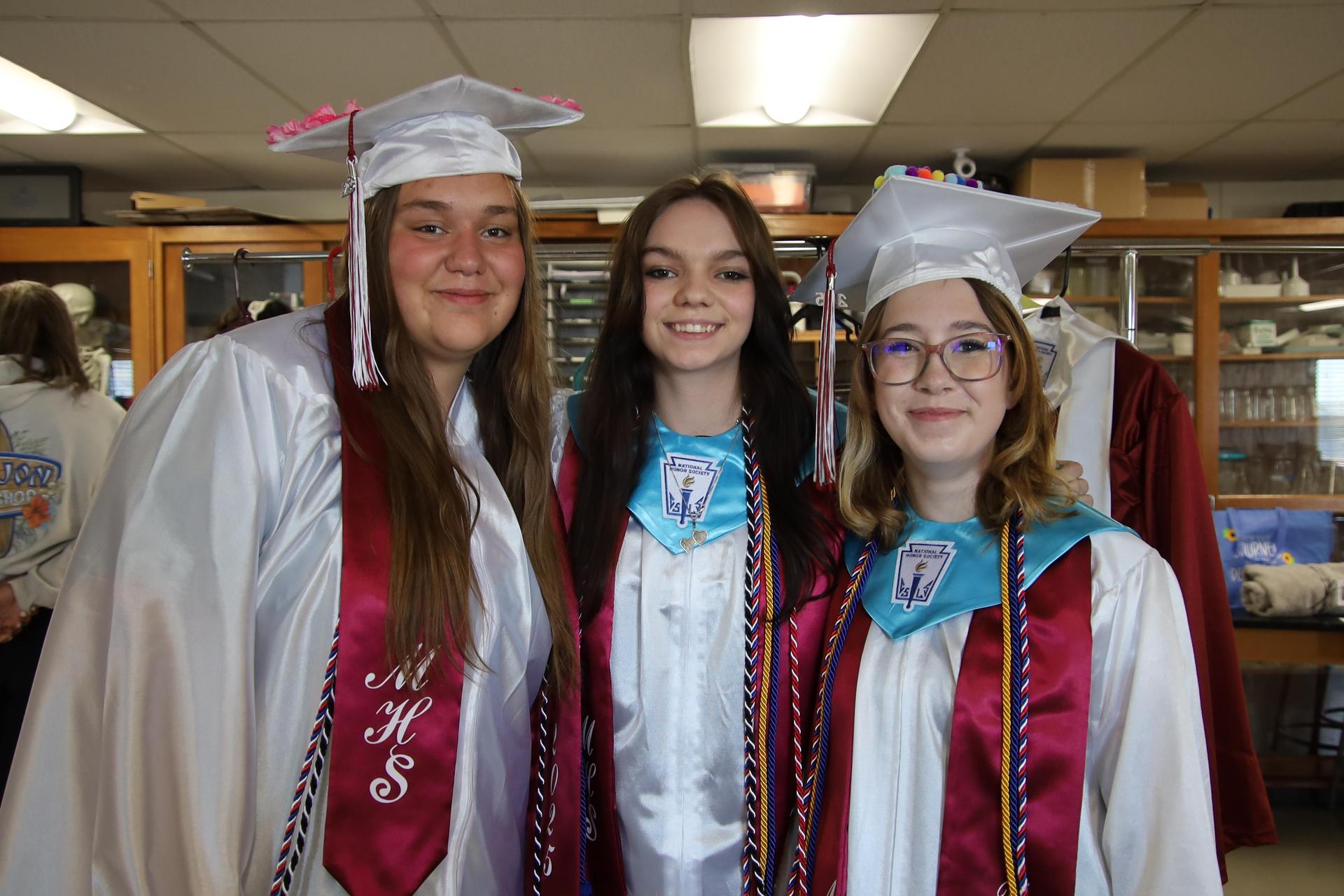 midwest graduates smiling for the camera