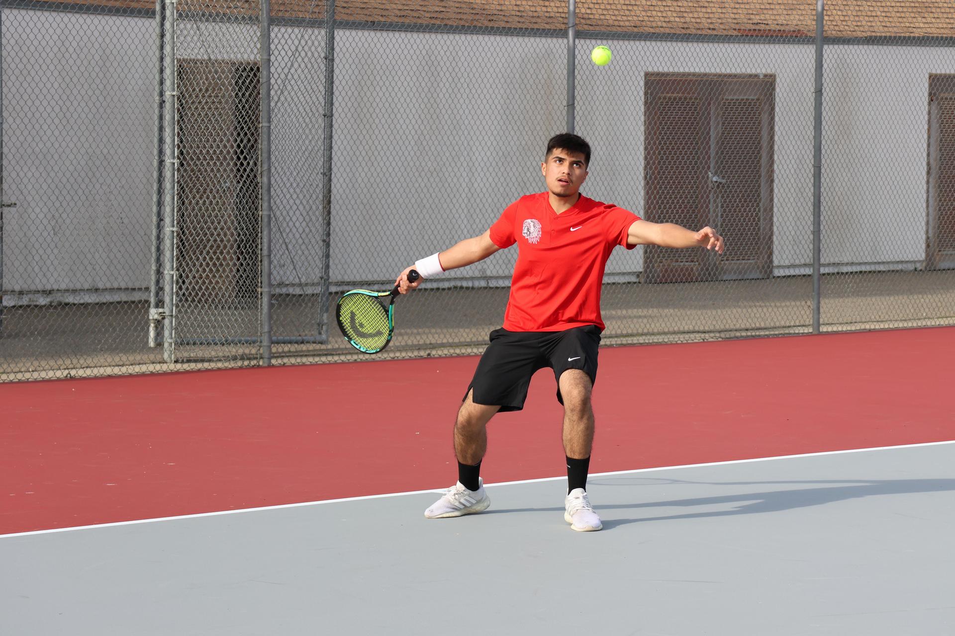 CUHS Boys playing tennis against coalinga