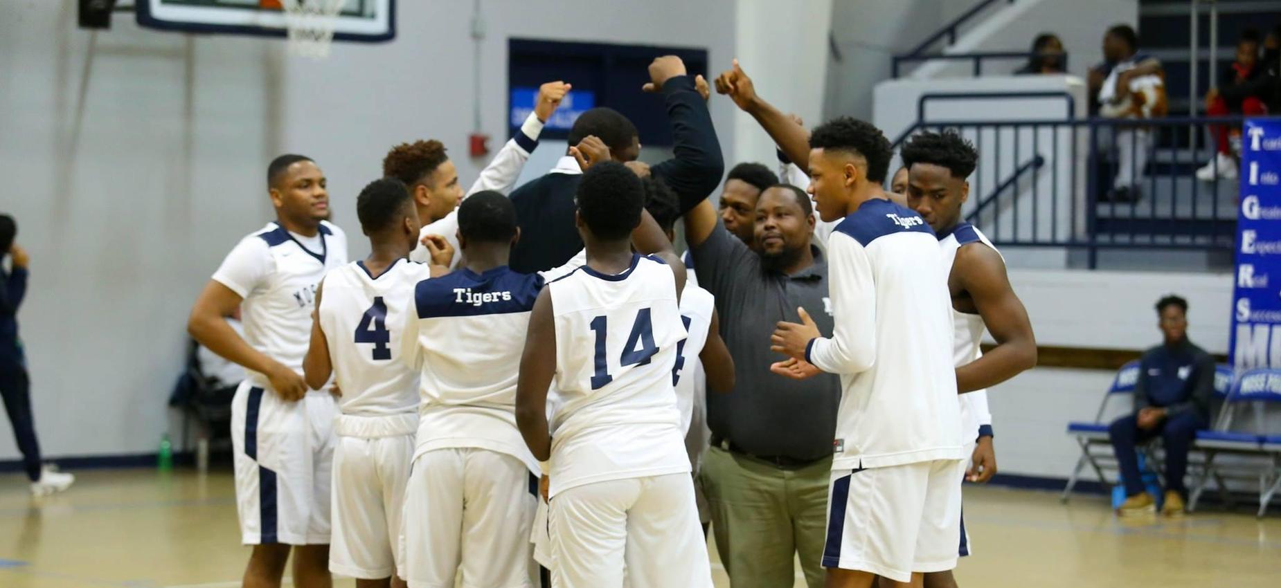 boys basketball group huddle