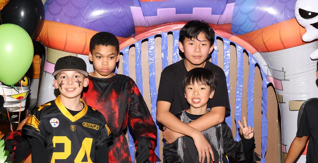 4 boys dressed in costumes.