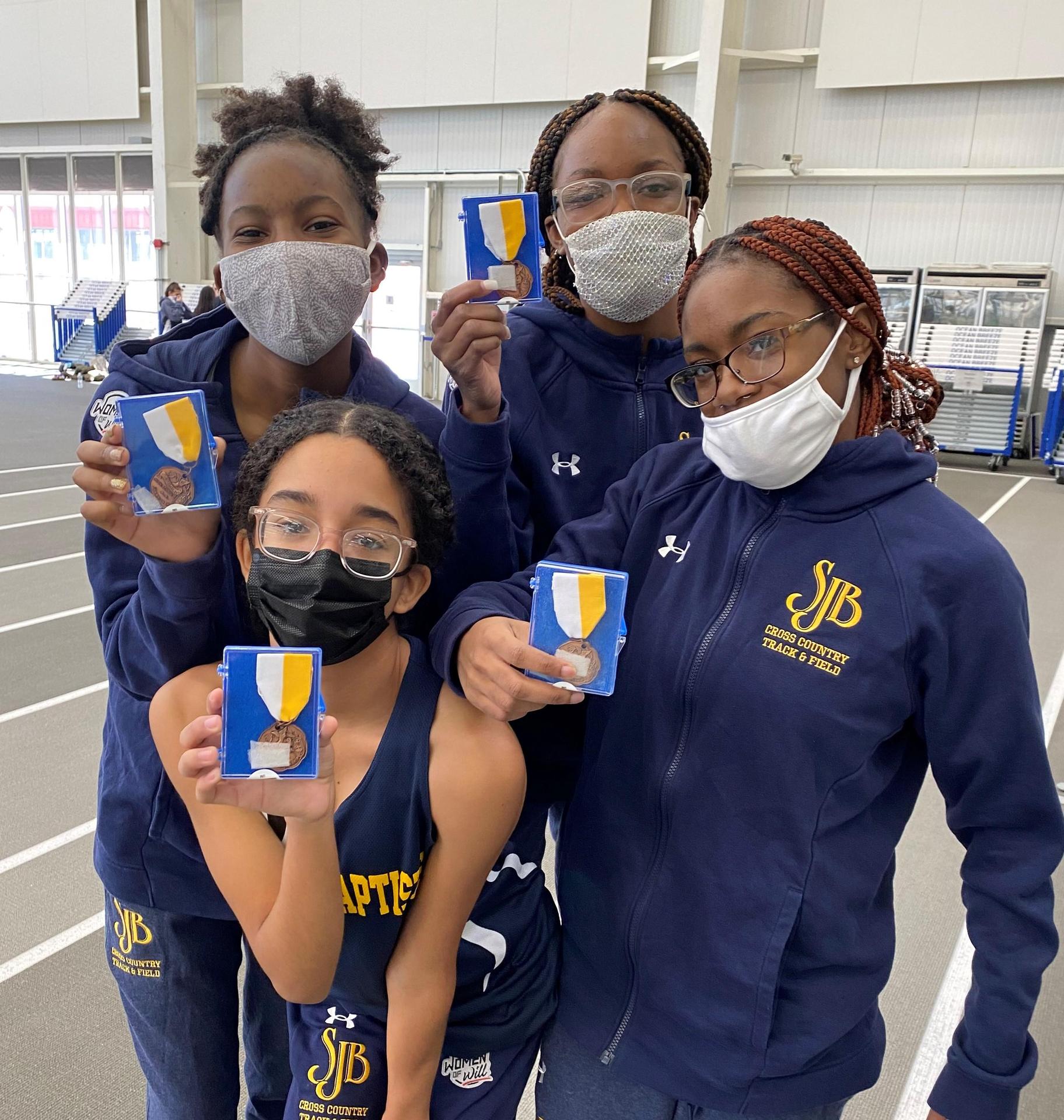 Girls in track and field uniforms