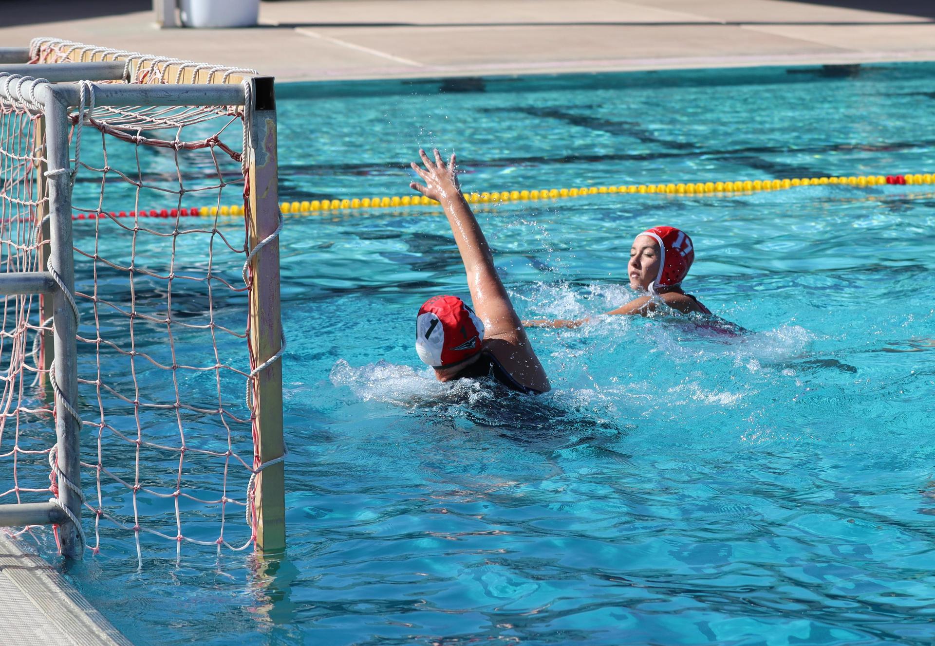 girls playing water polo against Hoover