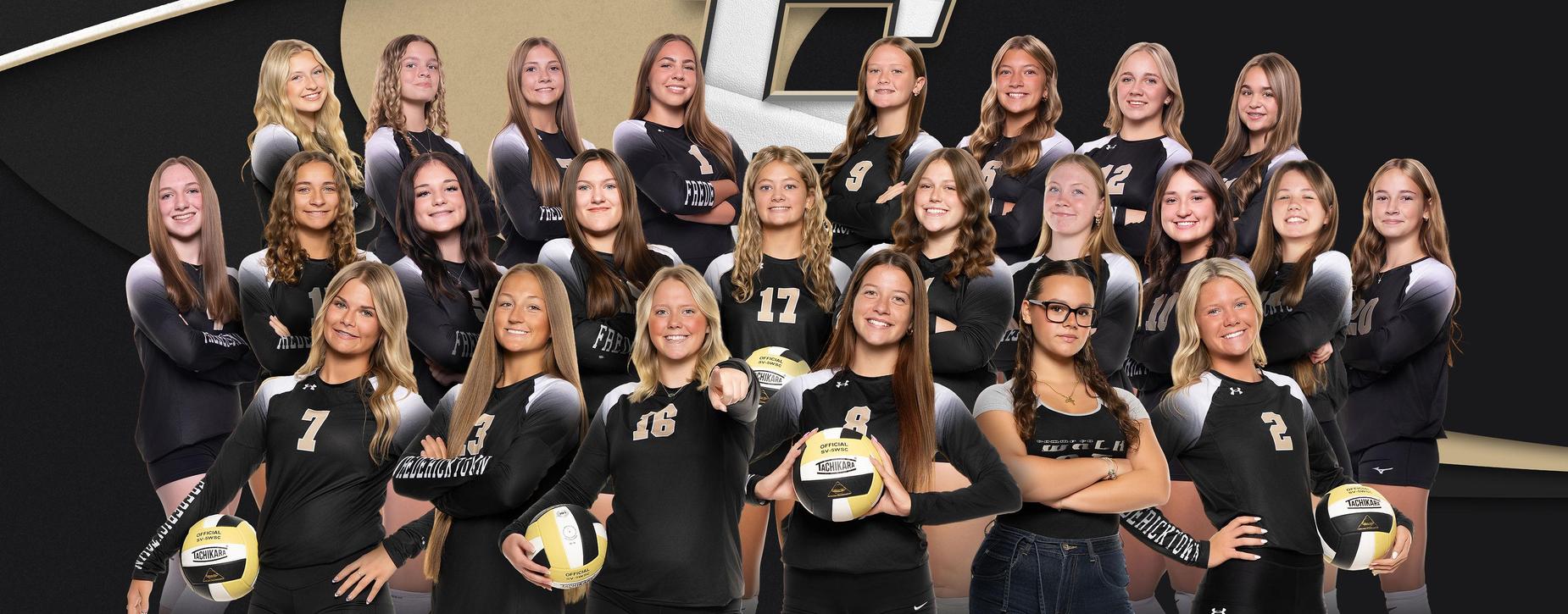 Group of female volleyball players posing with volleyballs.