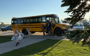 Student arriving at school on the bus.