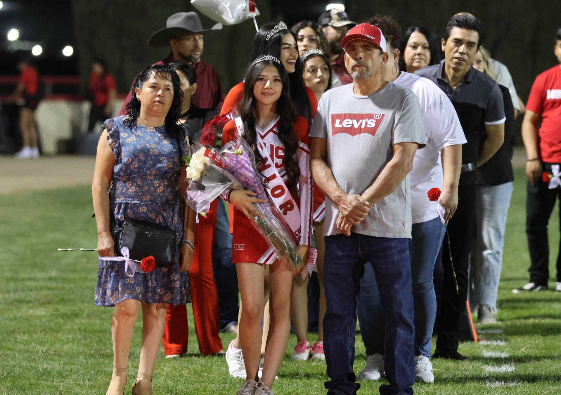 seniors and their escorts celebrating senior night