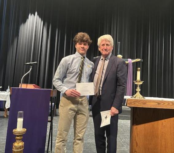 Bruin senior Jack Williams named National Merit Finalist. Here he stands with Principal John Jordan.