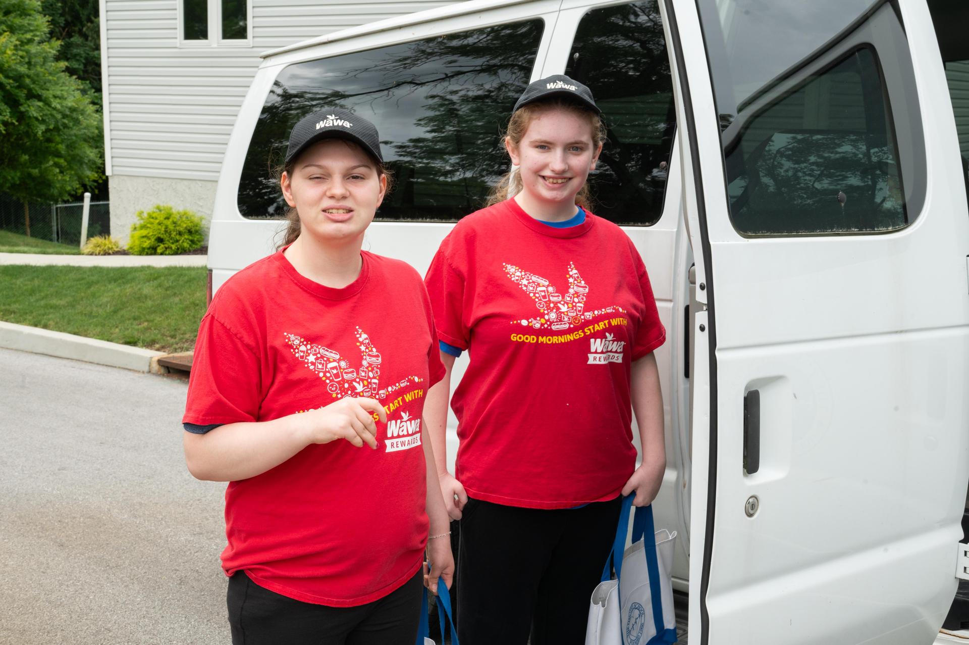 Students wearing Wawa uniform going to work.