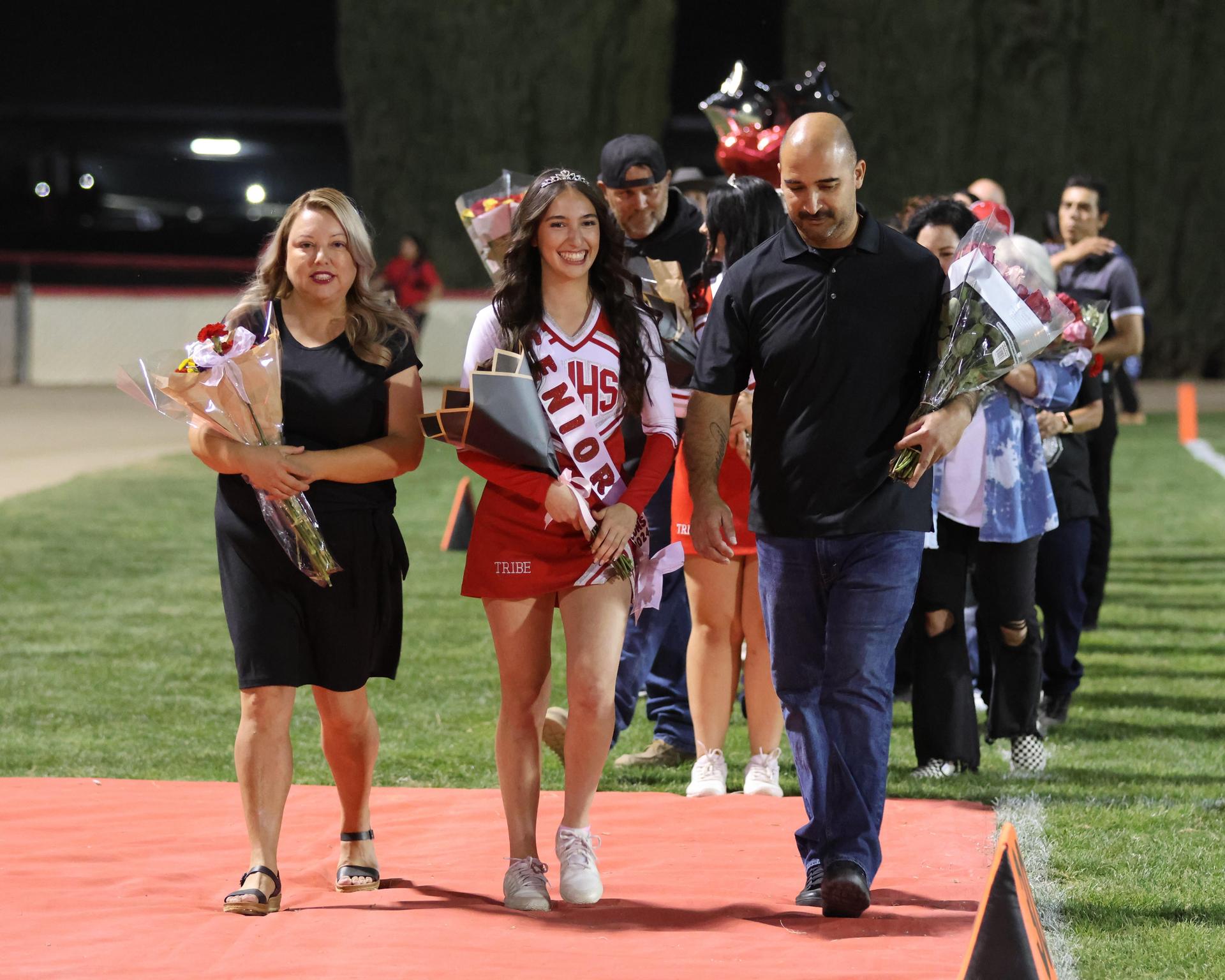 seniors and their escorts celebrating senior night