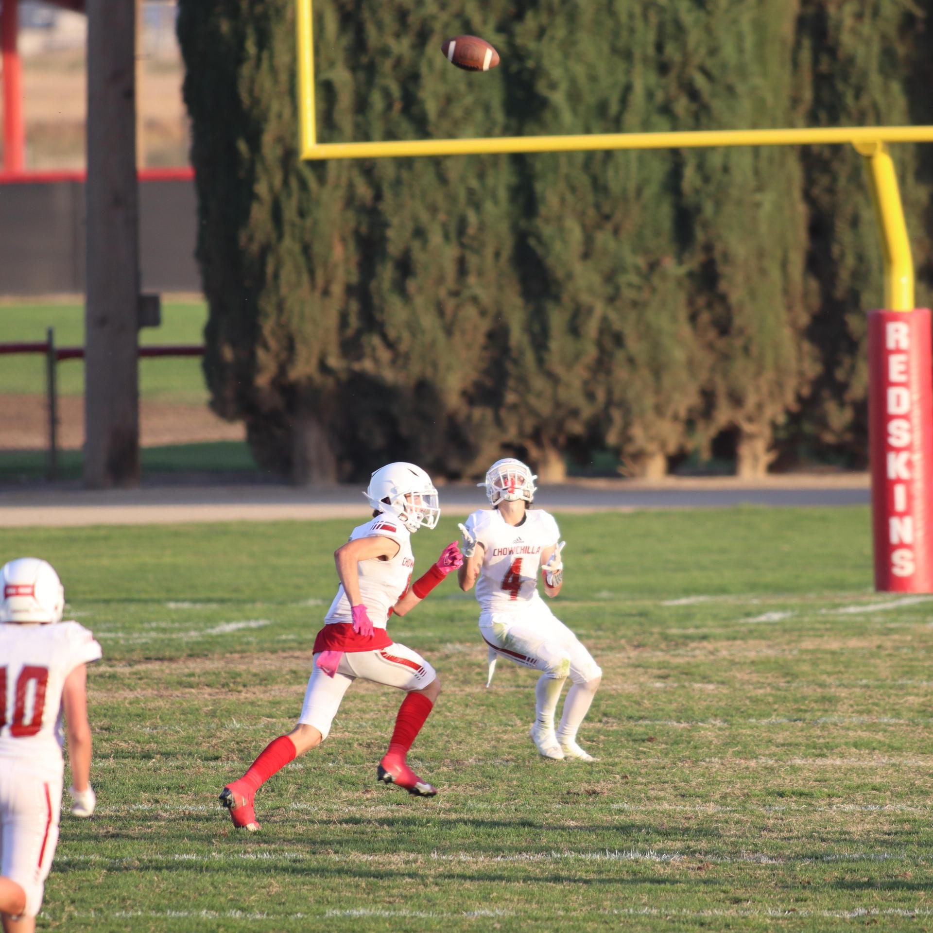 Junior Varsity football players in action against Caruthers