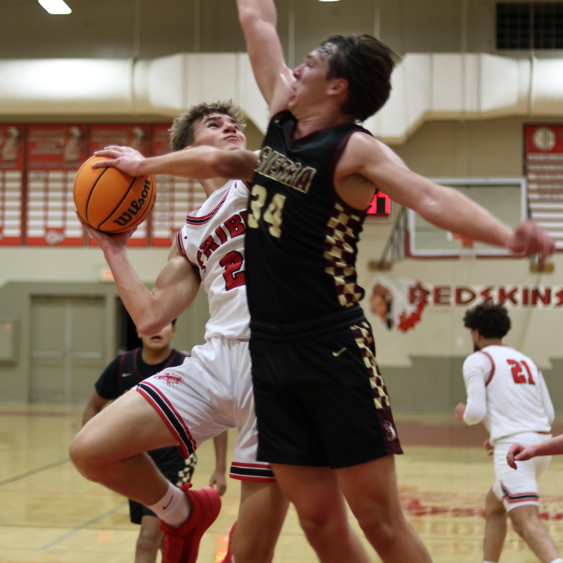 varsity boys basketball playing against sierra