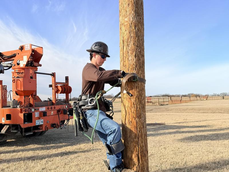 lineworker student climbing