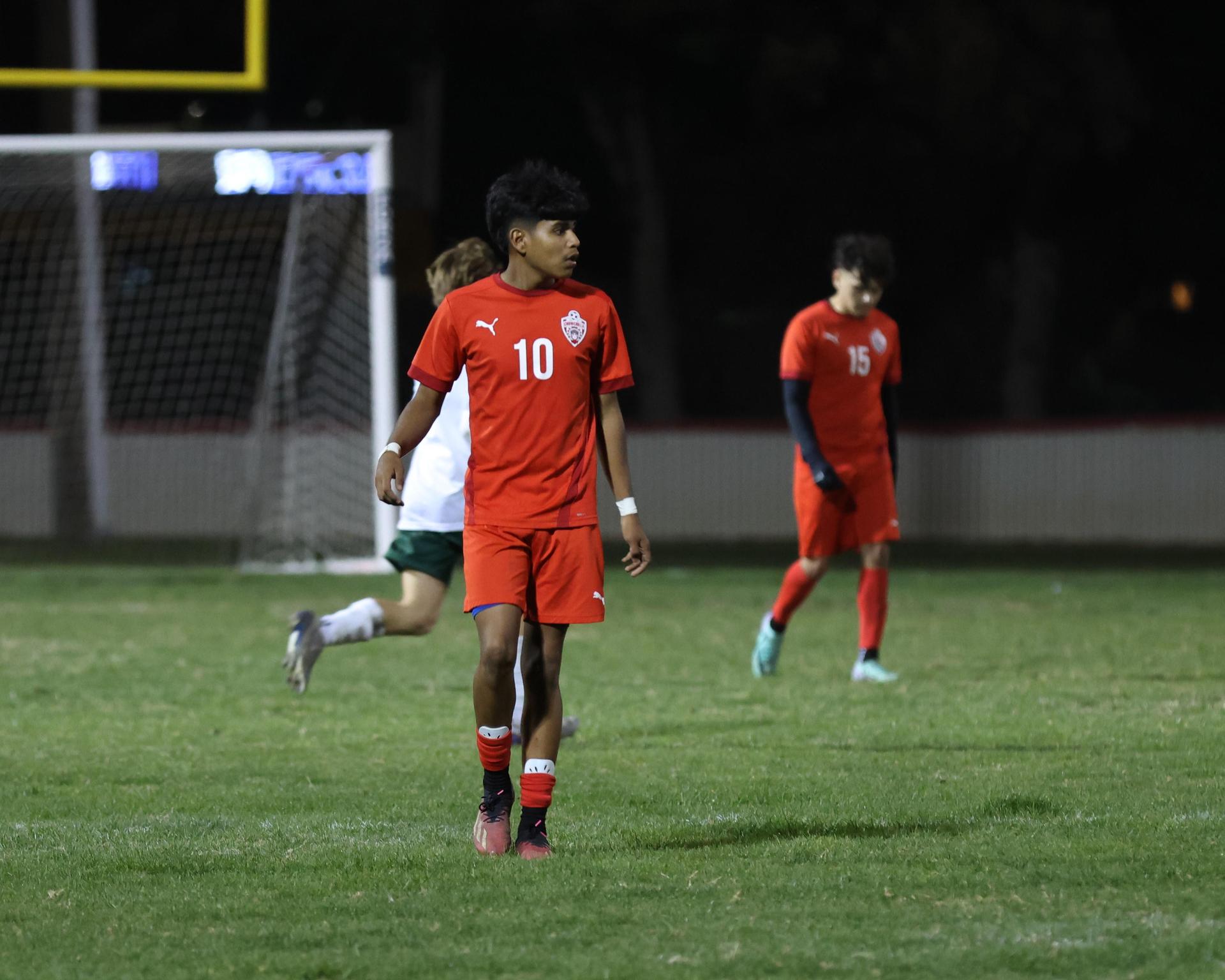Varsity boys play soccer against Kingsburg