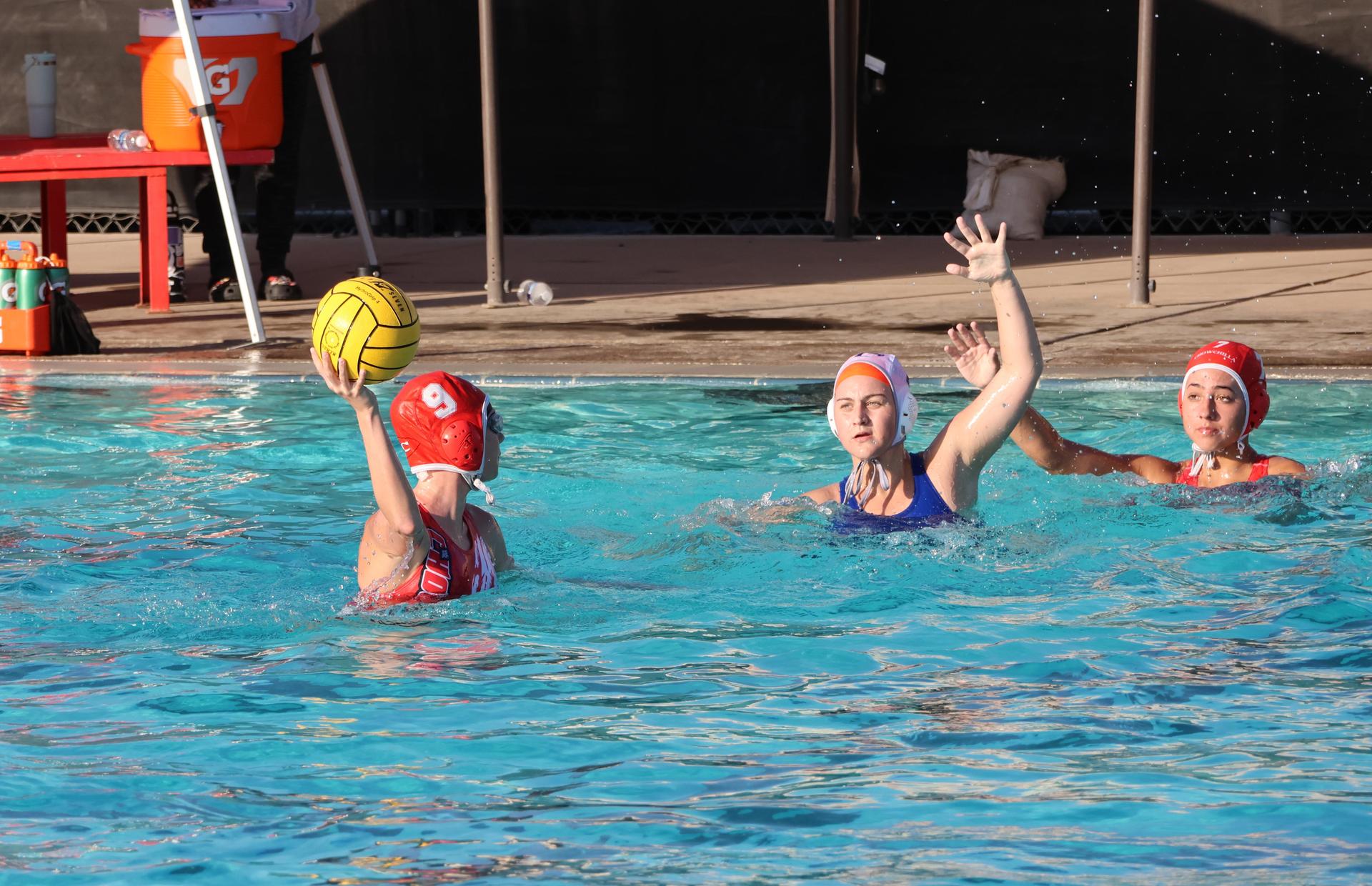 girls playing water polo against Sanger West