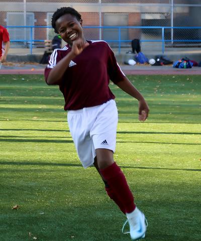 Student playing soccer.