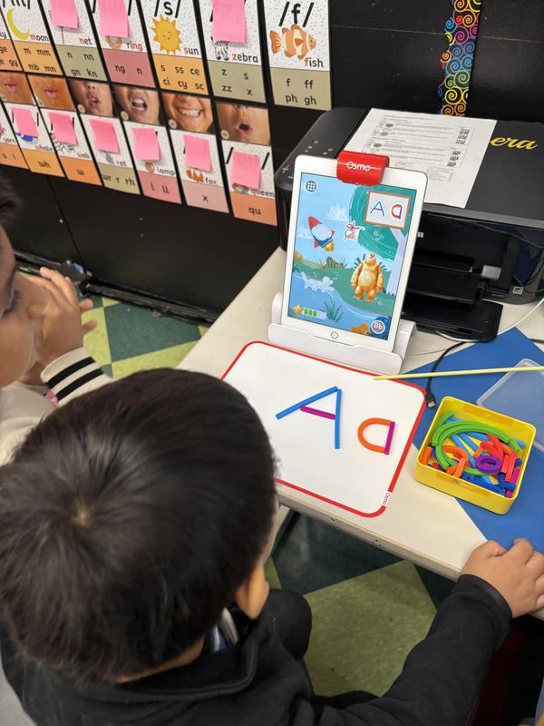 Students interacting with a video description to create a letter