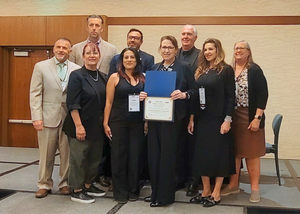 BPACE administrators and leaders take a group photo upon receiving their awards.