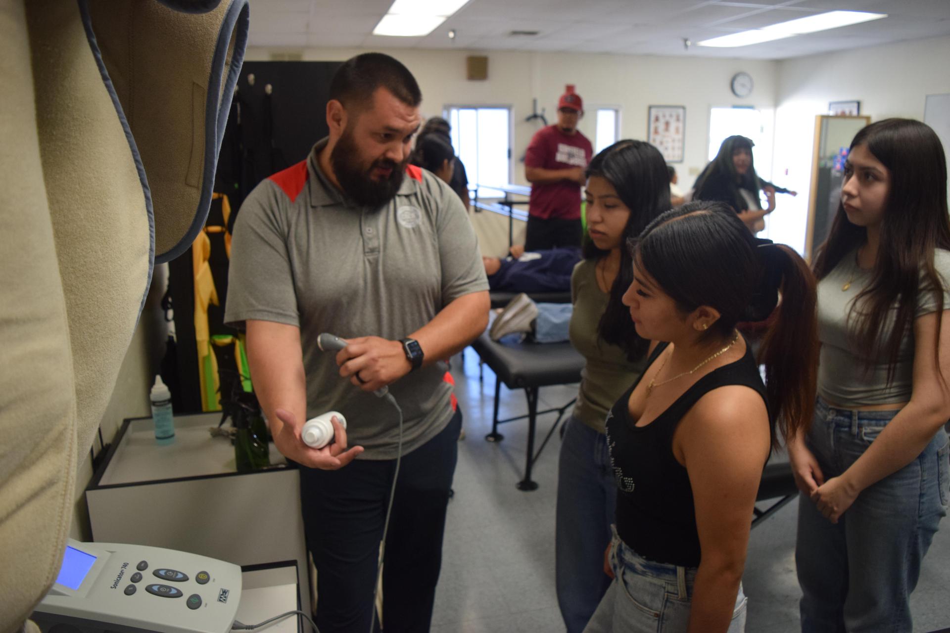 teacher working with students