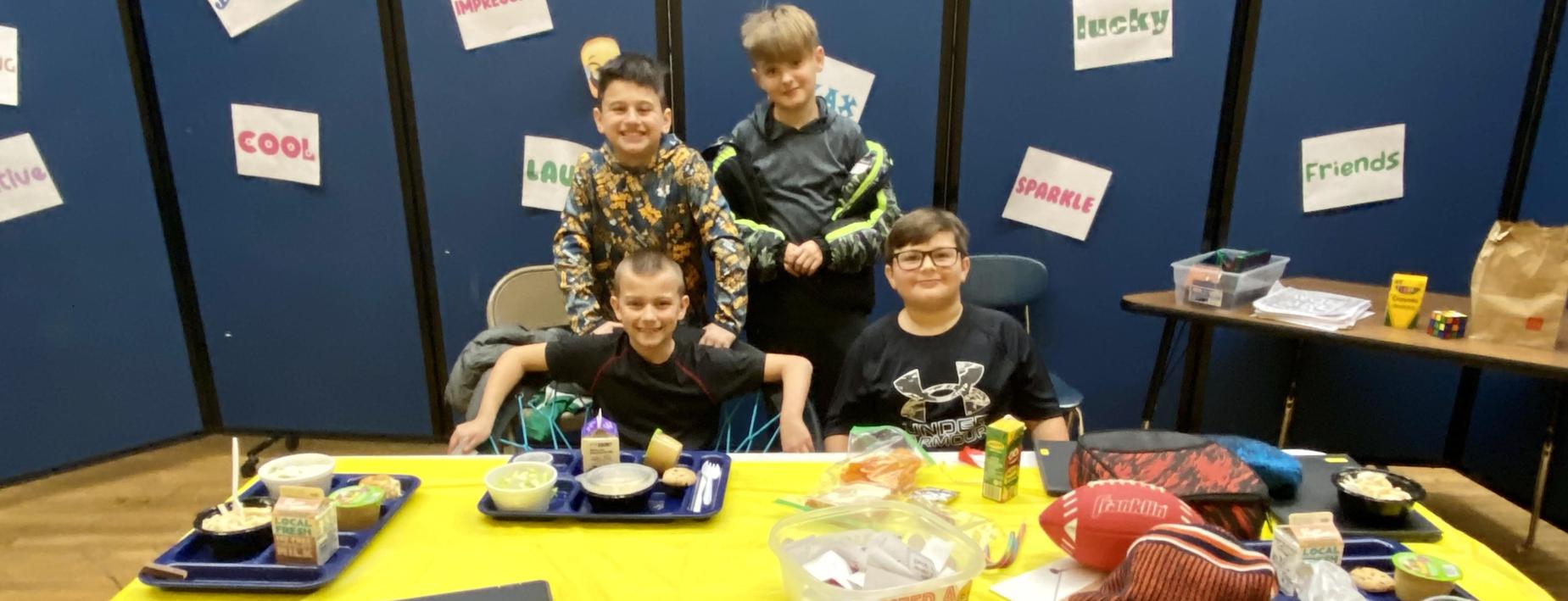 4 boys hanging out together at lunch