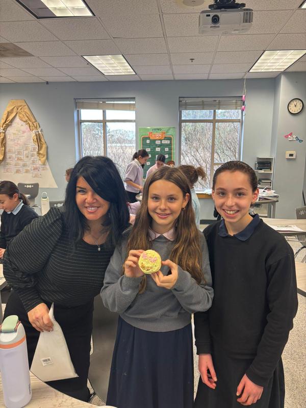 middle school students show off their sufganiot