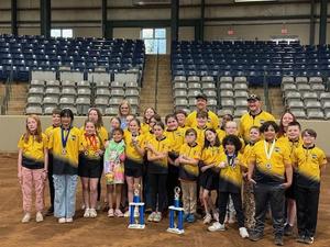 Archery team holding trophy