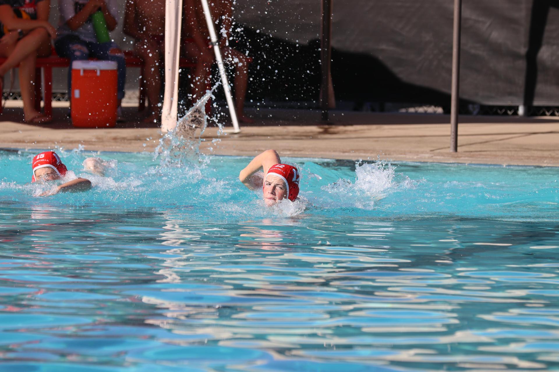boys playing water polo against Madera