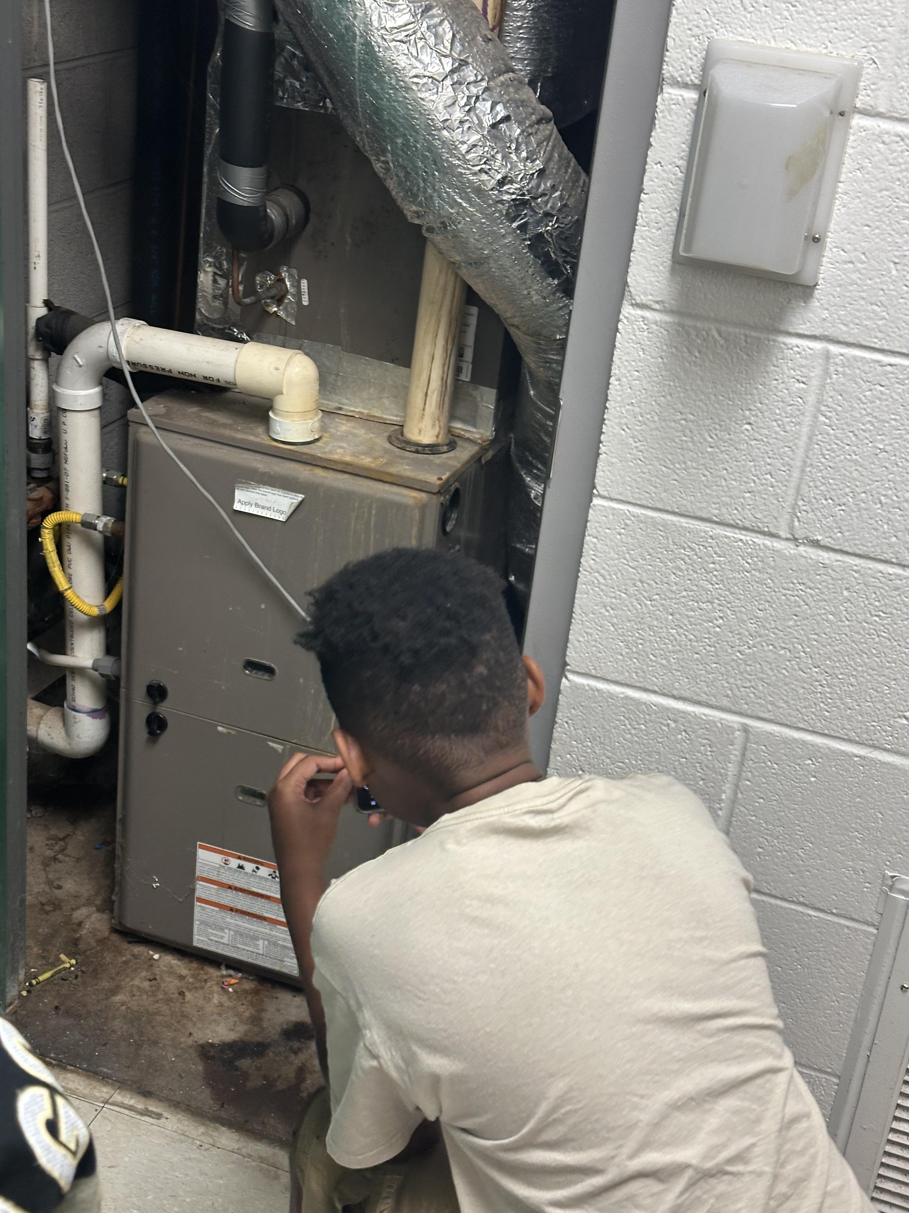 student learning to work with electricity