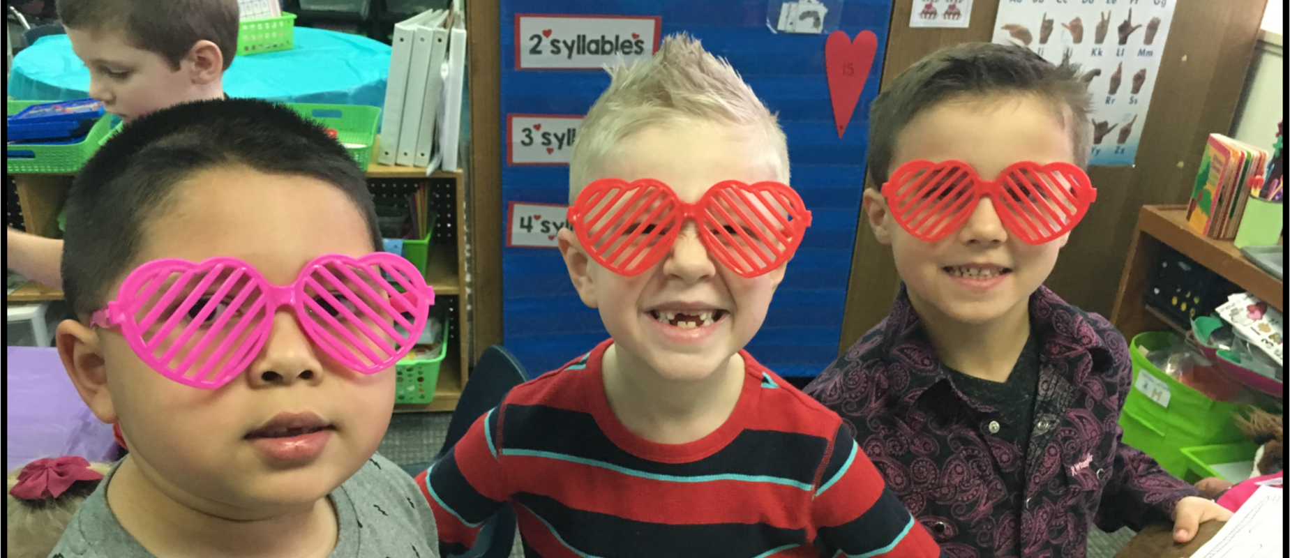 students smiling with glasses on
