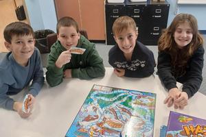 Fifth-grade students Oliver Kolano, Anthony Acquaviva, Cooper Watt, and Alora DeOrio play one of the new games
