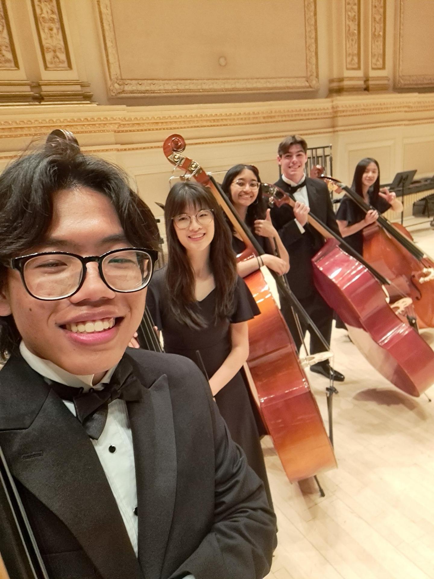 The Concert-Symphony Orchestra Bass Section posing for a selfie before performing at Carnegie Hall (Photo Courtesy of Josiah Chun) 